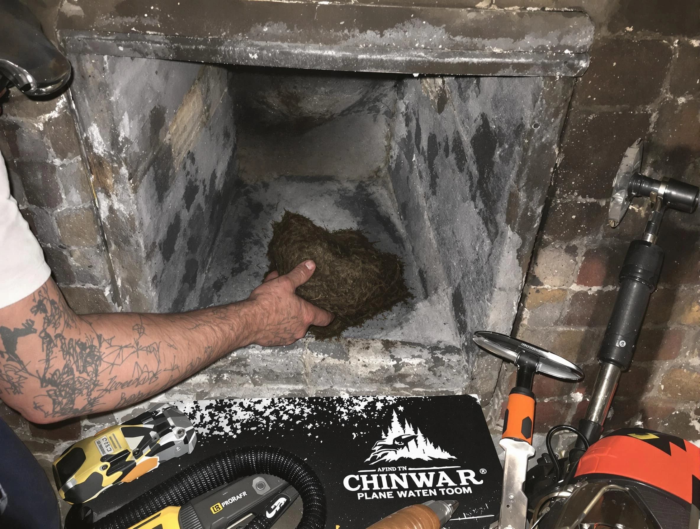 East Orange Chimney Sweep safely removing debris and screening chimney in East Orange, NJ